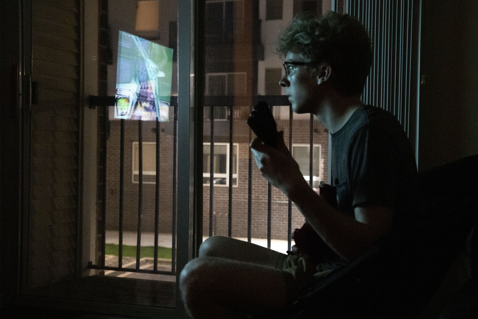 9:17 p.m.
Sophomore Jake Moe spends time practicing Guitar Hero on expert mode in his apartment at the University Commons. Moe’s roommates moved out once classes transitioned online, so he lives alone. Moe can spend hours playing and has become “the second best person he knows.”