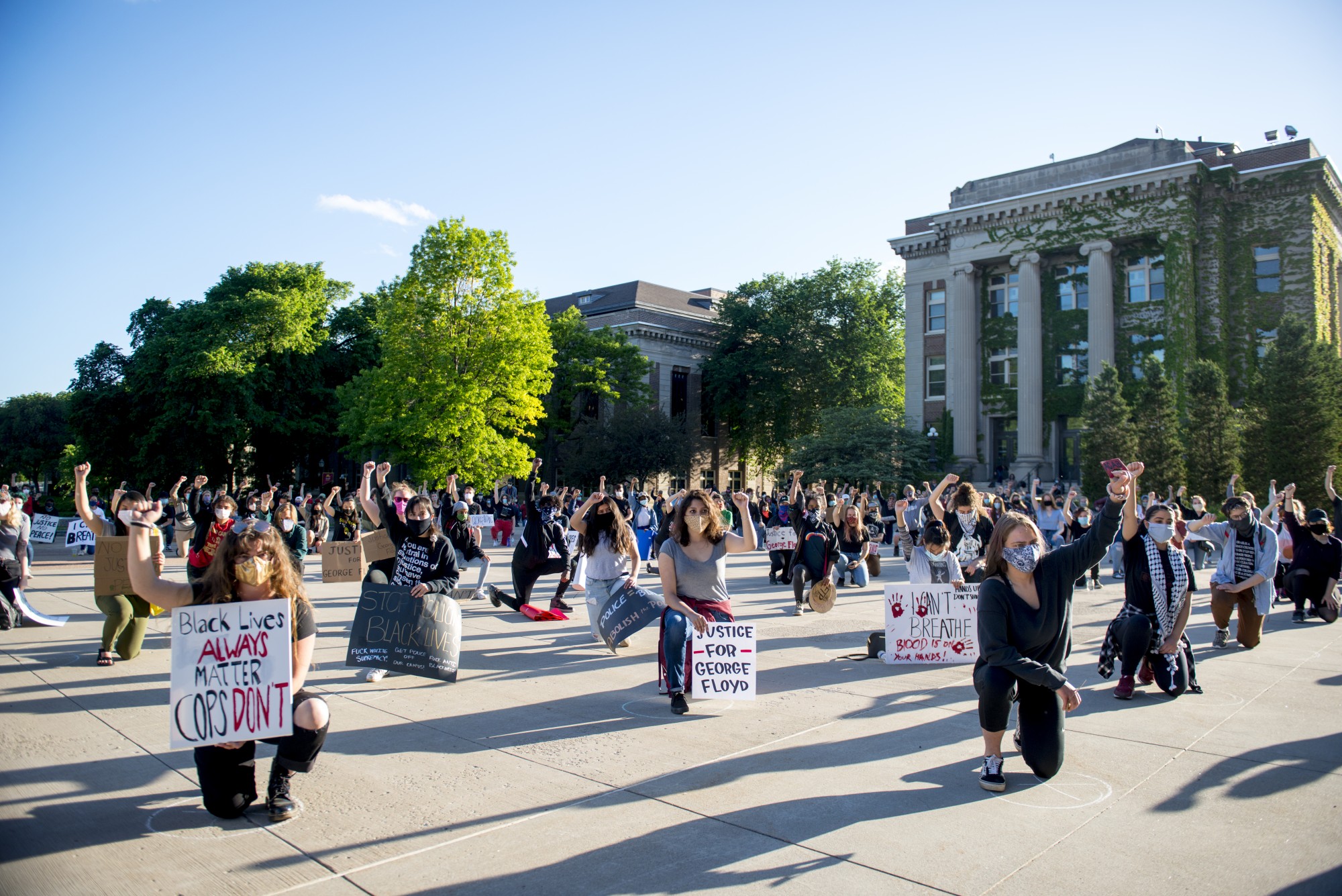 Student demonstrators gather outside of Northrop Auditorium on Friday, May 29 to protest the killing of George Floyd and the Minneapolis Police Department. Chalk marks were drawn 6 feet apart to help the crowd with social distancing. 