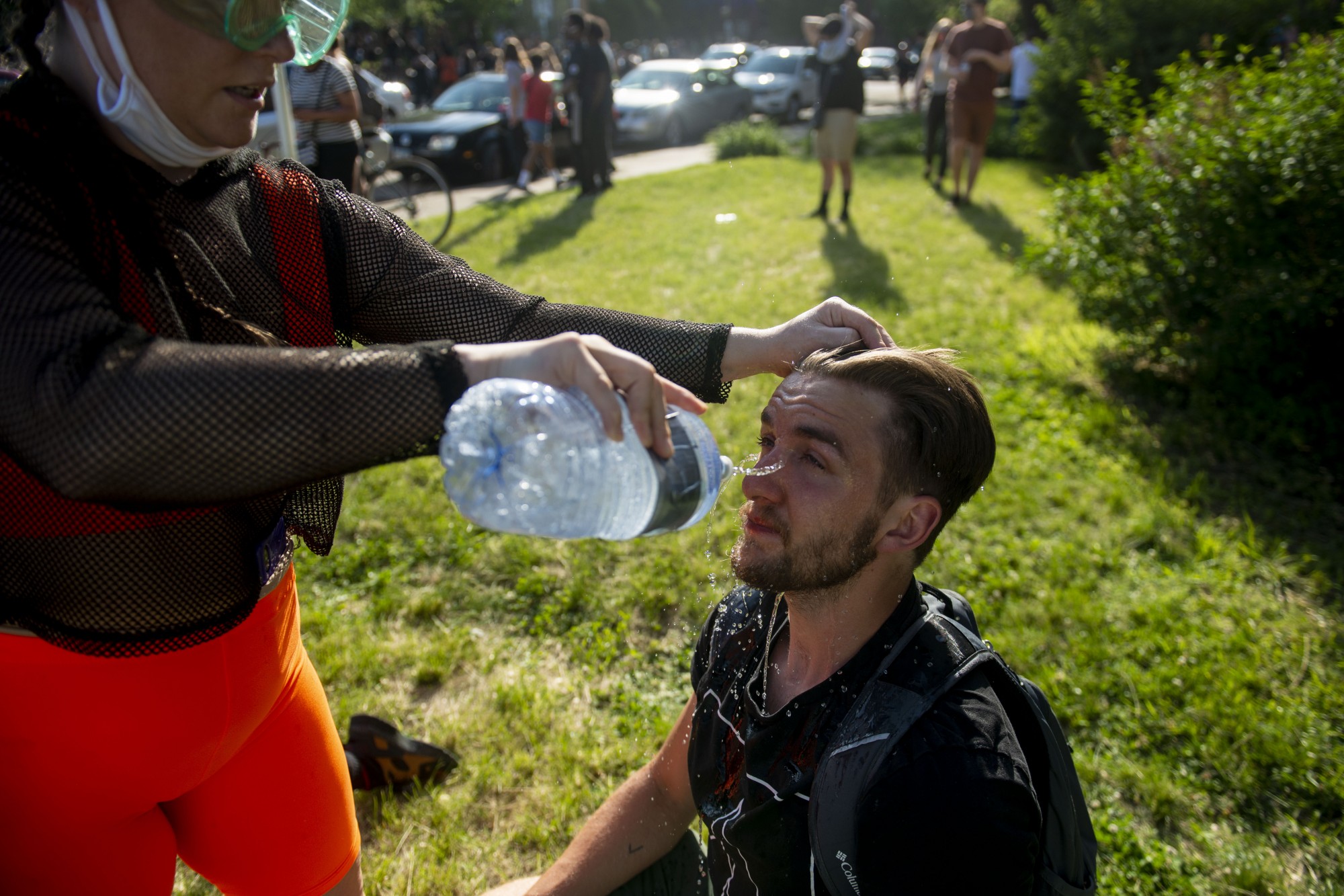 Water is poured on the face of a protester who was tear gassed at the intersection of 35W and University Avenue on Sunday, May 31. 