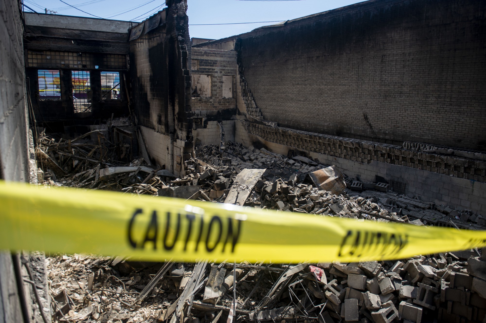 The remnants of a destroyed building lie on Lake Street in Minneapolis on Sunday, May 31. 