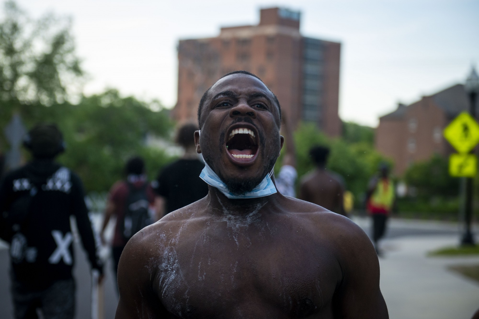 Demonstrators make their way through parts of campus as curfew nears, eventually crossing the Stone Arch Bridge and into downtown on Sunday, May 31. 
