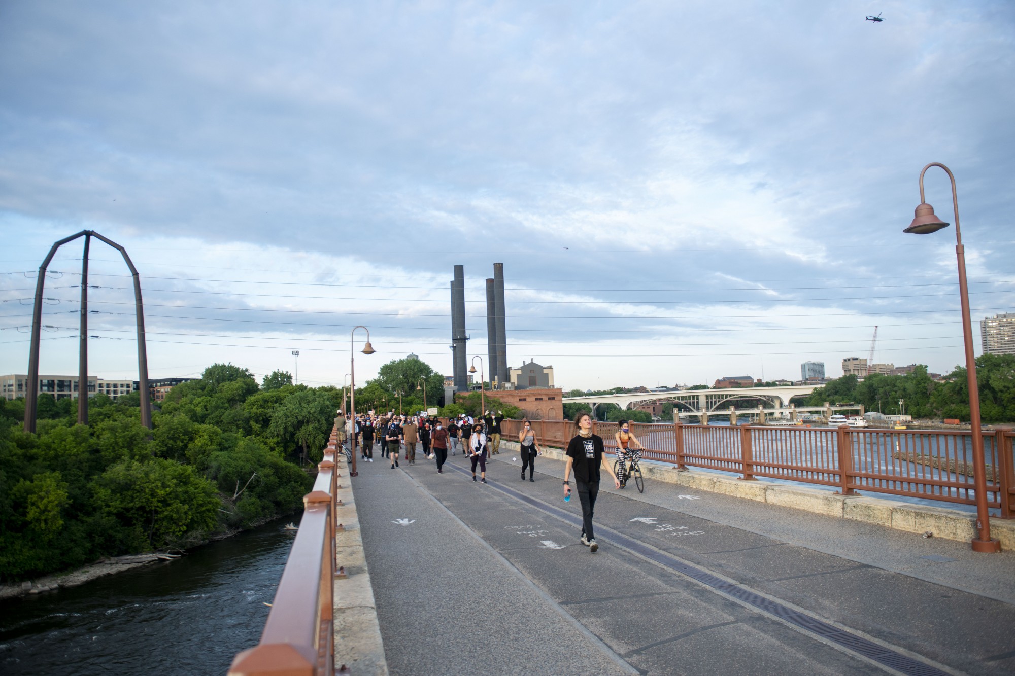 Demonstrators make their way from Marcy-Holmes to the Stone Arch Bridge and toward downtown Minneapolis on Sunday, May 31. 