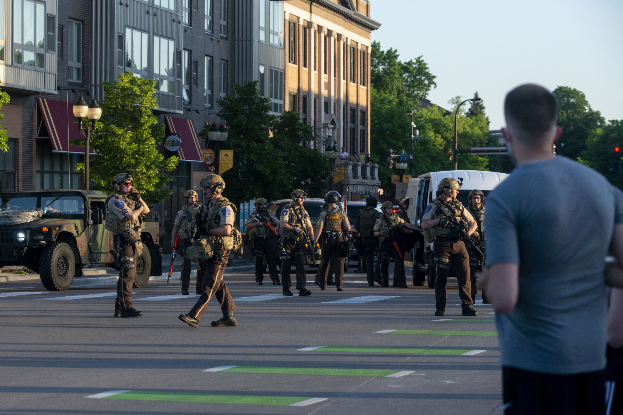 Dozens of SWAT officers patrol the intersection of Southeast 4th Street and 15th Avenue Southeast just after 8 p.m. on Monday, June 1. Several people were arrested during a mostly student-led demonstration halting traffic at the intersection. 
