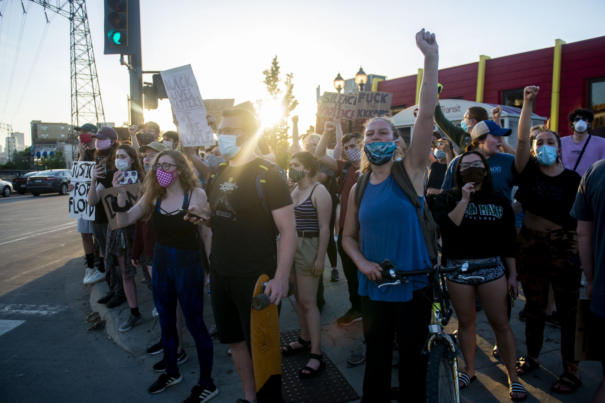 Protesters react to SWAT officers patrolling the intersection of Southeast 4th Street and 15th Avenue Southeast just after 8 p.m. on Monday, June 1. Several people were arrested during the mostly student-led demonstration halting traffic at the intersection.