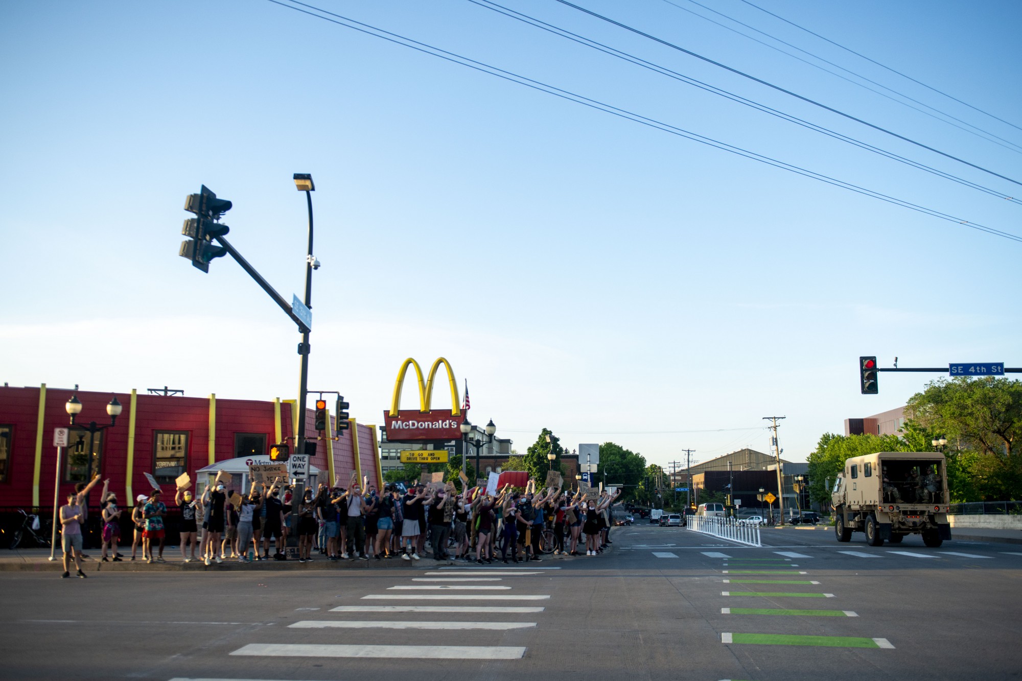 Protesters cheer as SWAT officers leave the intersection of Southeast 4th Street and 15th Avenue Southeast just after 8 p.m. on Monday, June 1. Several people were arrested during a mostly student-led demonstration halting traffic at the intersection. 