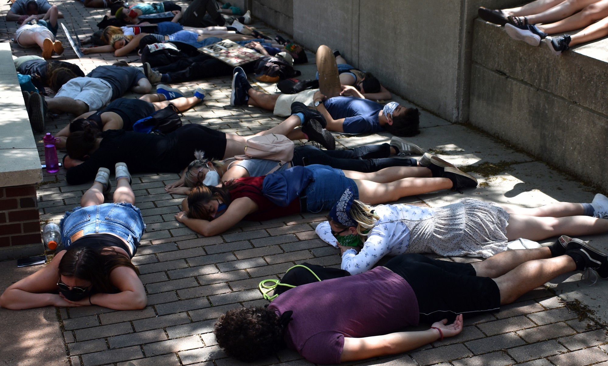 Protesters lay on the ground outside of University of Minnesota Police Department headquarters as part of a “die-in” demanding the University disarm and defund UMPD on Sunday, June 7. They laid on the ground for eight minutes and 46 seconds to honor George Floyd. 