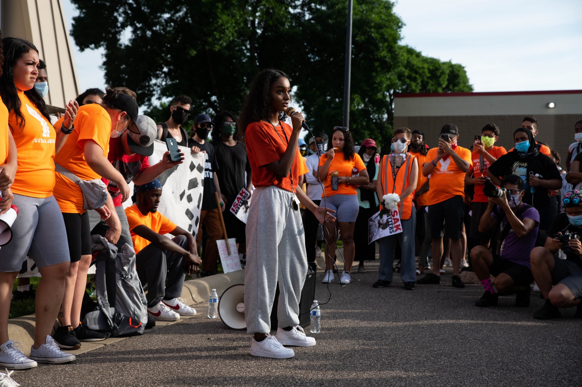 Sumaya Aden, Isak Aden’s sister, addresses protesters in a parking lot near Twin Cities Premium Outlets, the site where police killed 23-year-old Isak Aden in July of 2019 in Eagan on Wednesday, July 1. 