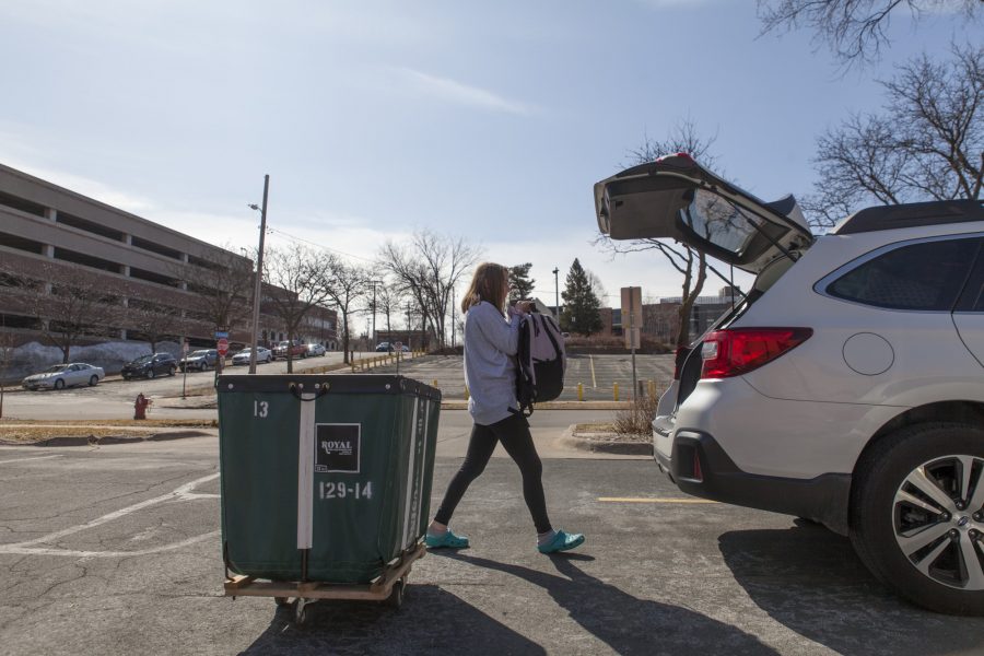 Freshman Marissa Mazzetta loads her belongings in preparation for her return to Illinois with her father, Jim Mazzetta, at Middlebrook Hall on Saturday, March 21. Mazzetta, like many freshmen at the University of Minnesota, moved out of University housing as a result of COVID-19.