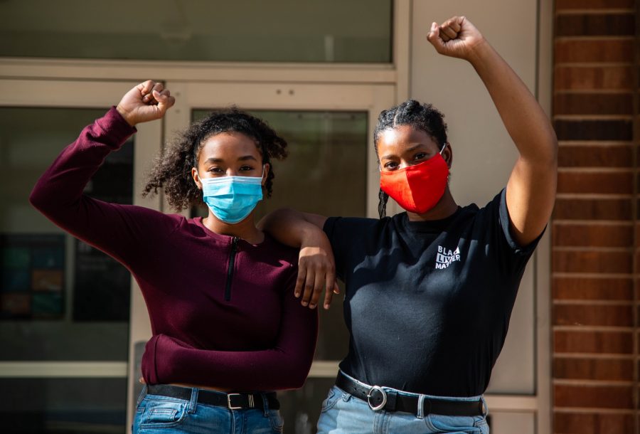 Jae-Lah Lymon, left, and Fanta Diallo stand for a portrait outside of the UMPD headquarters on the University of Minnesota, Twin Cities campus on Thursday, July 30 in Minneapolis. Students for a Democratic Society continues to push demands to disarm and defund UMPD while working to prepare students for interactions with UMPD. 