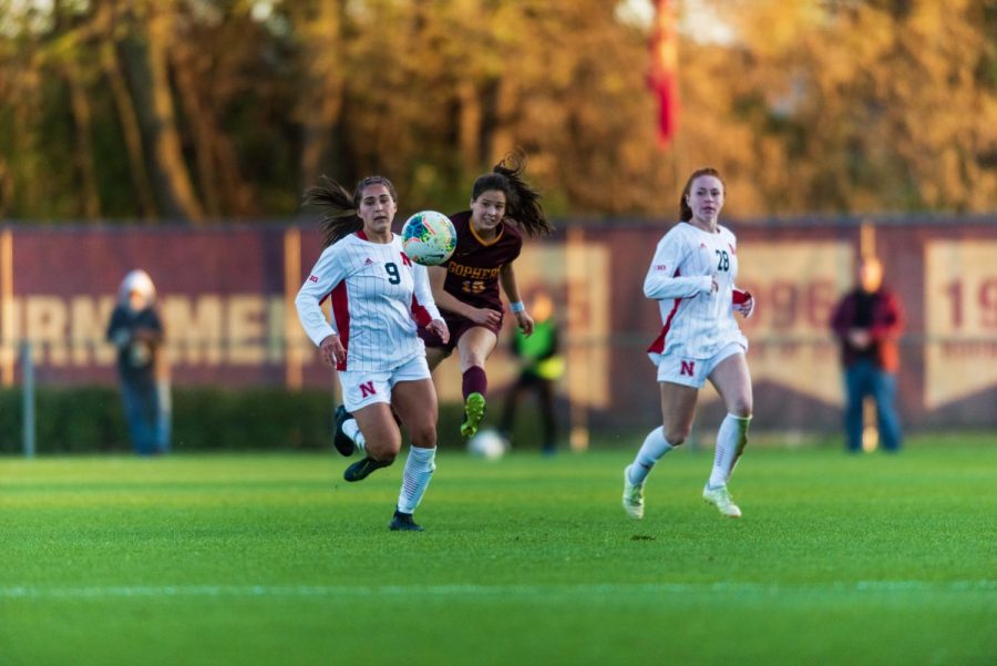 Gophers Midfielder Katie Duong launches a pass at Elizabeth Lyle Robbie Stadium on Thursday, Oct. 17. The Gophers went on to a tie game with Nebraska, 1-1.