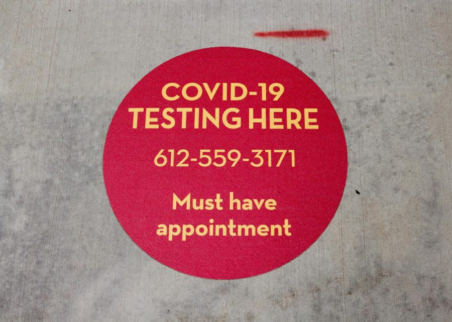 A+ground+sticker+located+in+front+of+Boynton+Health%E2%80%99s+COVID-19+testing+center+on+Wednesday%2C+Sep.+16.+The+testing+facility+is+a+small+tent+located+outside+the+main+entrance+of+Boynton.