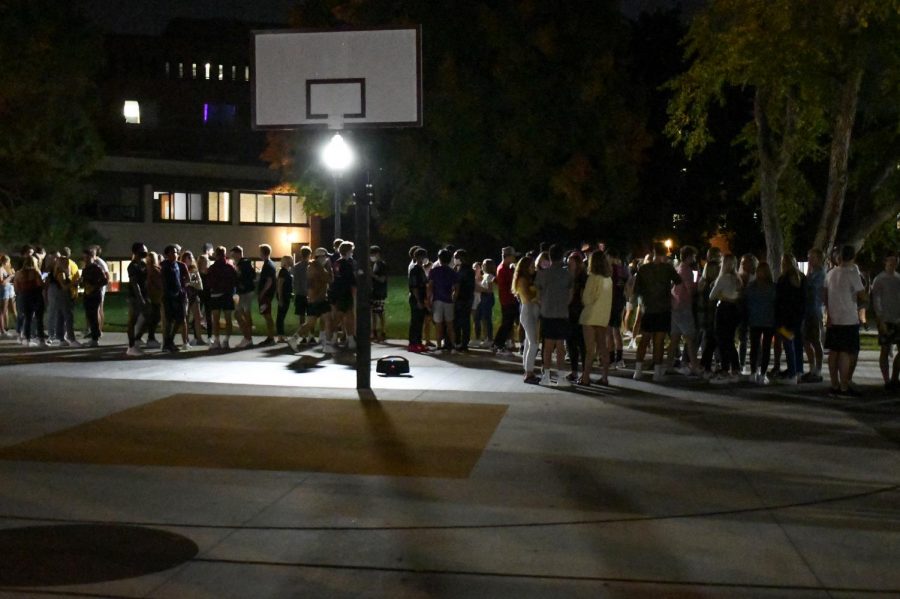 Students, many without masks and not following social distancing guidelines, gather to socialize in the Superblock plaza on Friday, Sep. 25. UMPD and Community Advisors sent the students back into their dorms before the 9 p.m. curfew.
