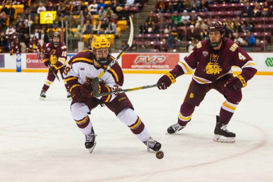 Gophers+Forward+Ben+Meyers+chases+the+puck+in+the+3M+Arena+on+Friday%2C+Oct.+25.++The+Gophers+went+on+to+lose+2-5+to+the+University+of+Minnesota+-+Duluth.