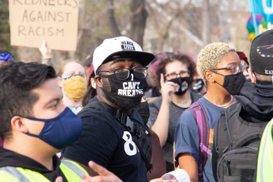 As speakers call out the names of people of color killed by police officers, participants sport apparel bearing parallel messages, such as masks declaring I cant Breathe in honor of George Floyd in South Minneapolis on Saturday, Nov. 7.