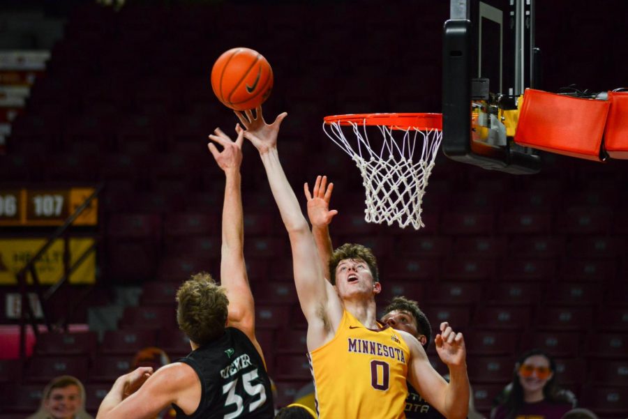 Gophers Center Liam Robbins leaps for the ball at Williams Arena on Friday, Dec. 4. The Gophers went on to a 76-67 victory over the North Dakota Fighting Hawks.