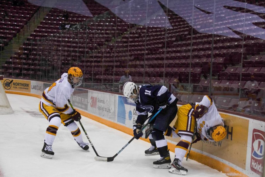 Gophers+forward+Jaxon+Nelson+fights+for+possession+against+Penn+State+at+the+3M+Arena+at+Mariucci+on+Thursday%2C+Nov.+19.