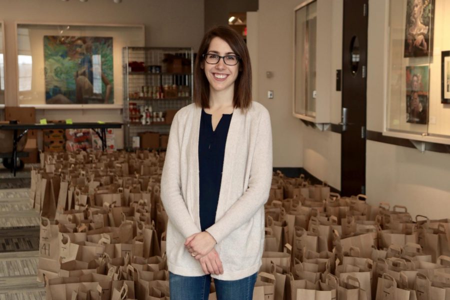 Health Promotion Specialist Rebecca Leighton poses for a portrait in front of the Nutritious U food pantry bags in Coffman Memorial Union on Wednesday, Feb. 17. Leighton leads the campus-wide strategic SNAP outreach project.