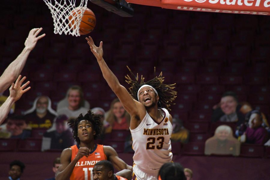 Brandon Johnson rebounds the ball during the first quarter against Illinois at Williams Arena on Saturday Feb. 20. The Gophers lost with a final score of 63-94.