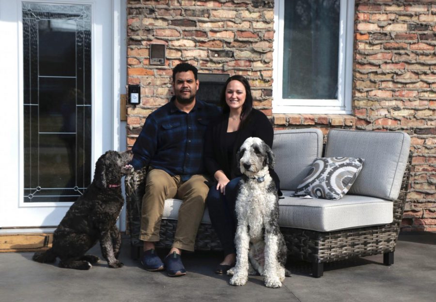 Maria+and+Miguel+Cisneros+pose+in+front+of+their+home+in+Golden+Valley%2C+Minnesota+with+their+dogs+on+Sunday%2C+March+21.+The+City+of+Minneapolis+signed+onto+the+Just+Deeds+project%2C+which+provides+a+pathway+for+homeowners+to+remove+racial+covenants+from+their+deeds.+Maria+proposed+this+project+to+the+Golden+Valley+City+Council+and+has+removed+a+covenant+on+her+own+deed.