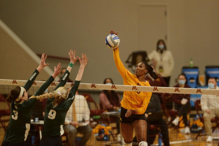 Opposite hitter Stephanie Samedy spikes the ball to earn a point for the Gophers in Maturi Pavilion on Sunday, Jan. 24. The Gophers won against Michigan State Spartans with a score of 3-0.