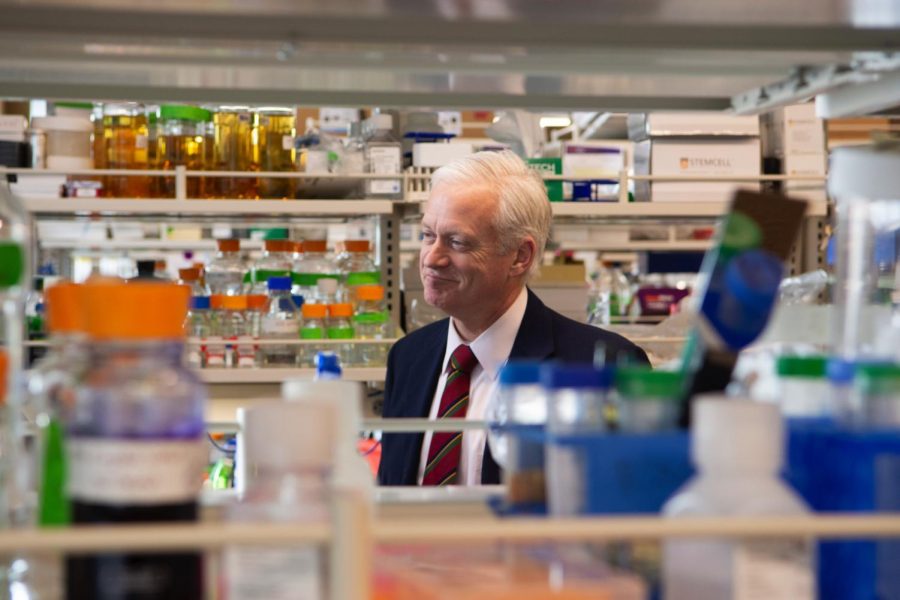 Chris Cramer visits Branden Moriartys lab in the Cancer & Cardiovascular Research Building, Feb. 25, 2020.