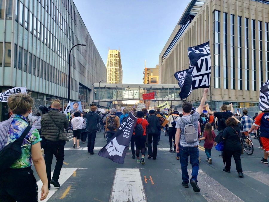 Protesters march in downtown Minneapolis on Monday, March 29. A coalition of activist groups held a protest calling for justice for George Floyd on opening statement day of the trial against Derek Chauvin.