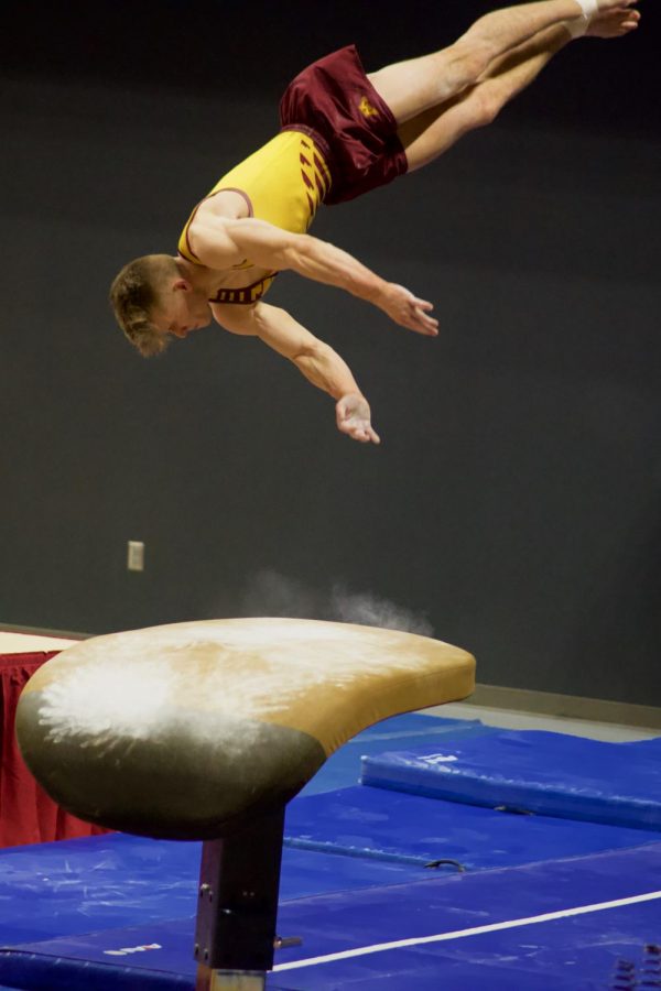 Senior+Gymnast+Shane+Wiskus+does+his+routine+on+the+vault+at+Maturi+Pavilion+on+Saturday%2C+March+6.+The+Gophers+won+against+Penn+State.