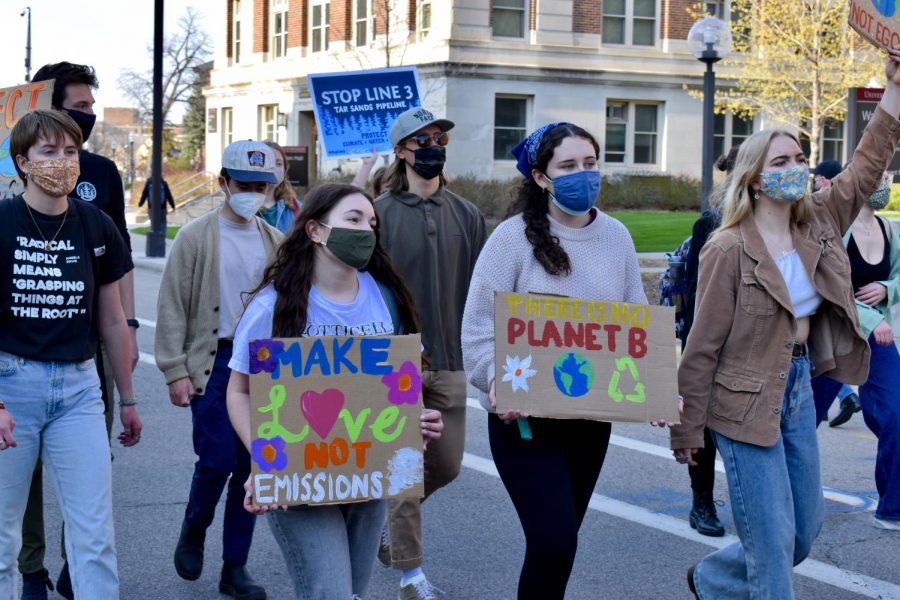 Students participate in a protest organized by the Environmental Student Association outside of Northrop Auditorium on Thursday, April 22. The protest demanded environmental, racial, and disability justice.