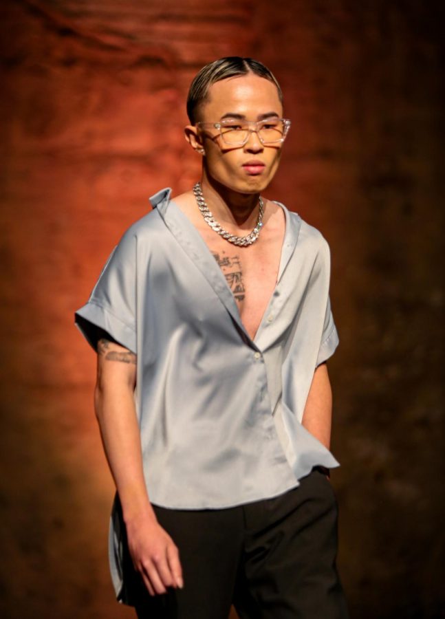 Hand in pocket, Phillip Lim walks down the runway at Golden Magazine’s fashion show at Aria, Thursday, Sept. 16. Golden Magazine’s show, titled “Golden Runway,” was apart of Fashion Week Minnesota.