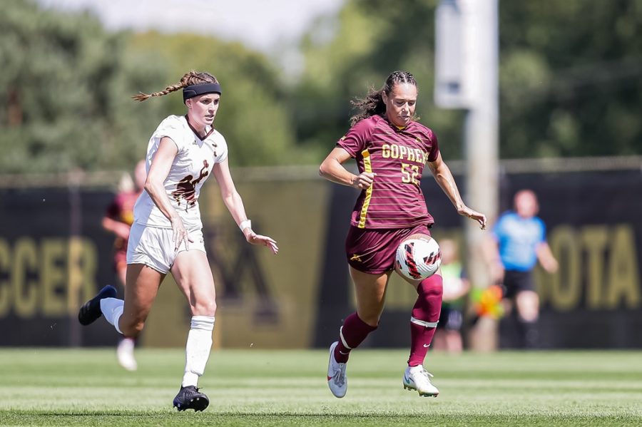 Junior Izzy Brown fights for possession against a University of Wyoming defender on Sunday, Sept. 5, 2021, at Elizabeth Lyle Robbie Stadium in St. Paul, Minn.