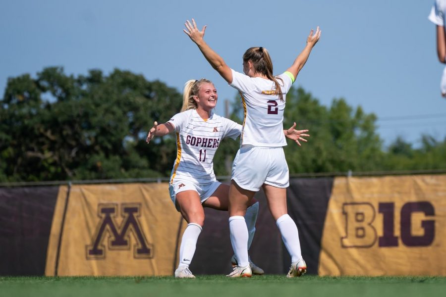 Graduate+student+Makenzie+Langdok+celebrates+after+her+first+goal+of+the+season+with+freshman+teammate+Lauren+Donovan+in+a+match+against+the+University+of+North+Dakota+on+Sunday%2C+Sept.+12%2C+2021%2C+at+Elizabeth+Lyle+Robbie+Stadium+in+Falcon+Heights%2C+Minn.