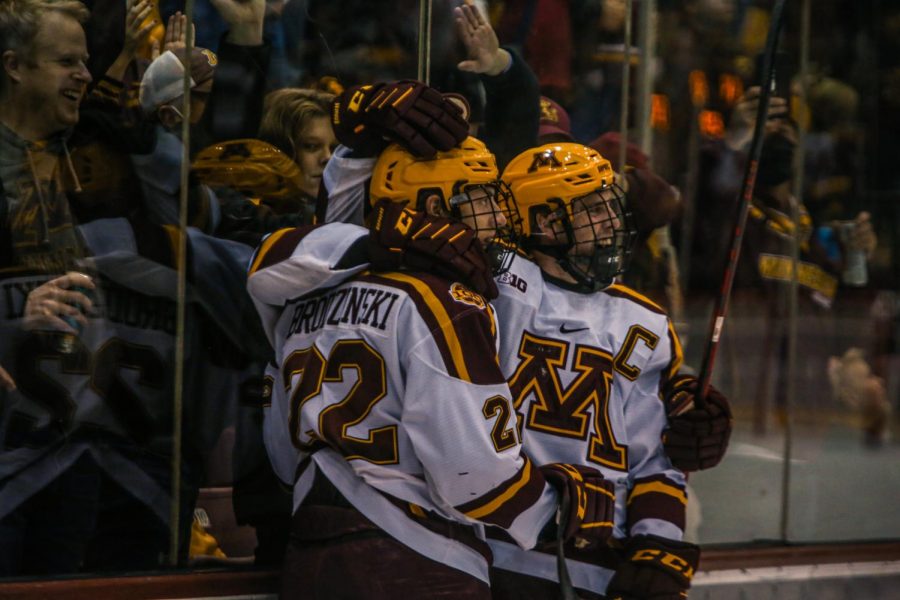 Junior Bryce Brodzinski celebrates with senior Captain Sammy Walker in a game against the University of Notre Dame  on Friday, October 29, 2021 at 3M Arena at Mariucci in Minneapolis, Minn. 