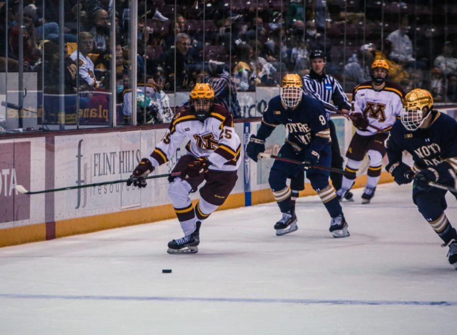 Junior Jack Perbix chases the puck down the ice in a game against the University of Notre Dame on Friday, Oct. 29, 2021 at 3M Arena at Mariucci in Minneapolis, Minn. 