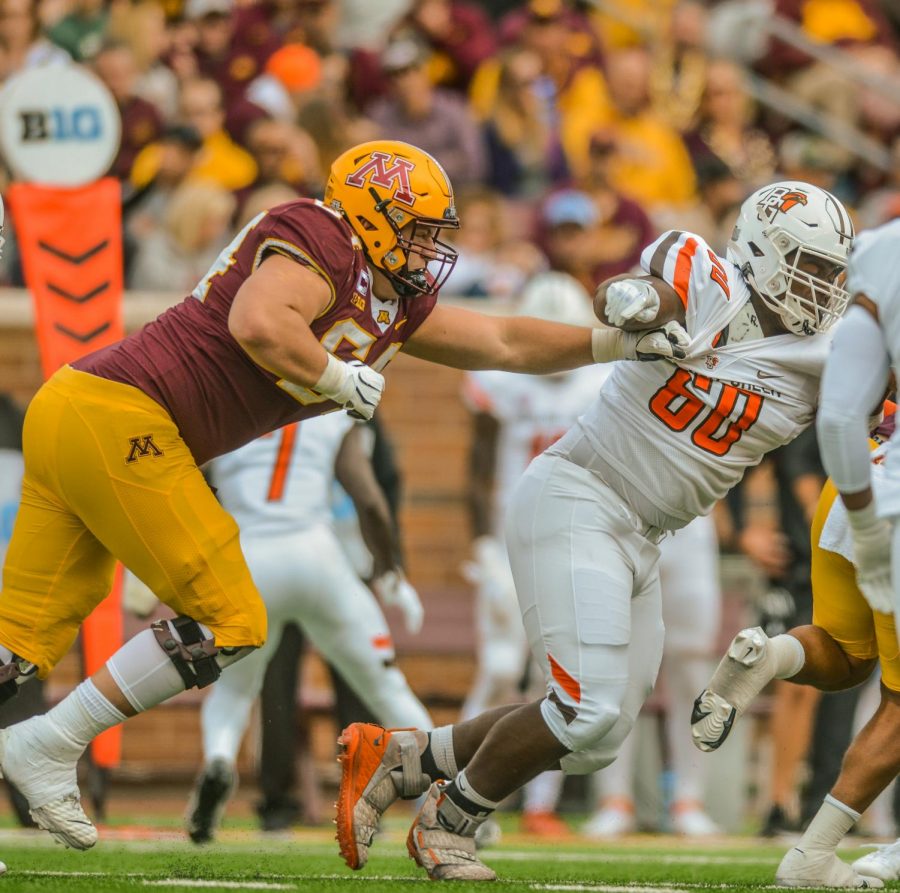 Linebacker+Conner+Olson+tugs+at+Bowling+Green%E2%80%99s+Dontrez+Brown+during+the+University+of+Minnesota%E2%80%99s+game+against+Bowling+Green+at+Huntington+Bank+Stadium%2C+Saturday%2C+Sept.+25.+The+Gophers+fell+to+the+Falcons%2C+14-10.+