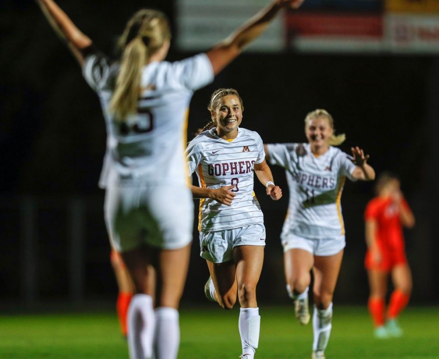 Senior McKenna Buisman celebrates her first career brace with teammates Sophia Boman and Lauren Donovan in a match against Illinois on Thursday, Oct. 14, 2021, at Elizabeth Lyle Robbie Stadium in Falcon Heights, Minn.