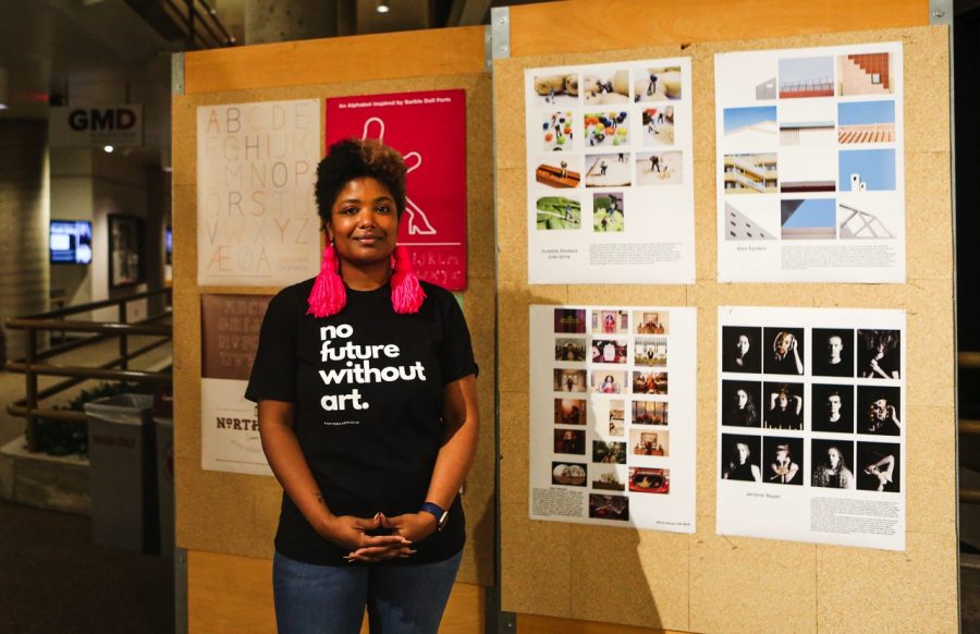 Professor Terresa Moses poses for a portrait in front of student designs in McNeal Hall on Thursday, Nov. 11. Moses has helped organize a College of Design initiative to create space, policies and practices that support the inclusion and retention of BIPOC artists.