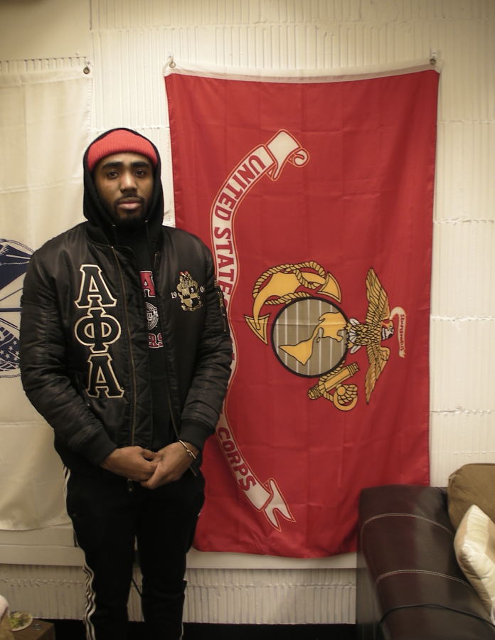 Aijalon Langston by his service flag at the SVAM Lounge
