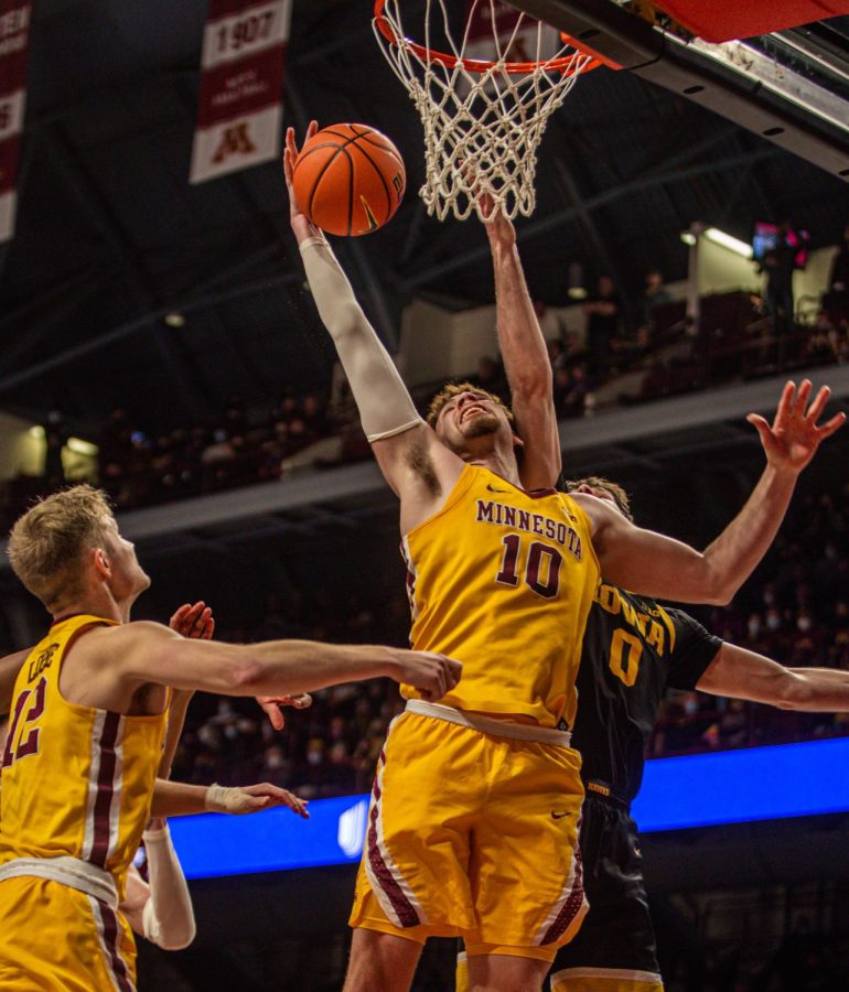 Forward Jamison Battle reaches for the basket in a game against the University of Iowa on January 16, 2021 at Williams Arena in Minneapolis, Minnesota. 