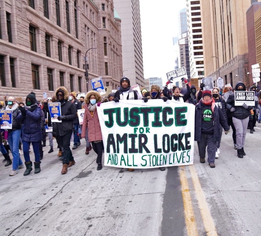 Community activists lead chants as protestors march towards the 1st Minneapolis Police Precinct on Saturday, Feb. 5, 2022. The protest was held to honor Amir Locke, who was fatally shot by Minneapolis Police officer Mark Hanneman earlier that week.