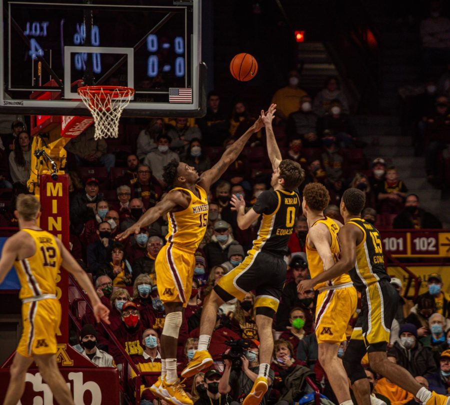 Senior Charlie Daniels jumps to block a shot in a game against he Iowa Hawkeyes on Jan. 16, 2022, at Williams Arena in Minneapolis. 