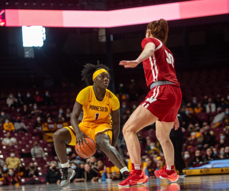 Minnesota guard Alexia Smith dribbles the ball through her leg in a game against the Wisconsin Badgers on Sunday, Jan. 30 at Williams Arena in Minneapolis, Minn. The Gophers won that game 57-55. 