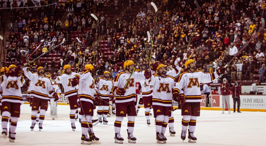 Members of the Minnesota mens hockey team give a stick salute to the fans at 3M Arena at Mariucci in Minneapolis, Minn. after completing a sweep of the Wisconsin Badgers with an 8-0 win on Saturday, Feb. 26, 2022. 