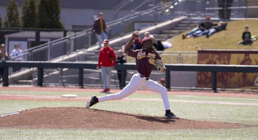 Pitcher J.P. Massey throws from the mound at Siebert Field in Minneapolis, Minn. in a game against Maryland on Saturday, April 9, 2022. 
