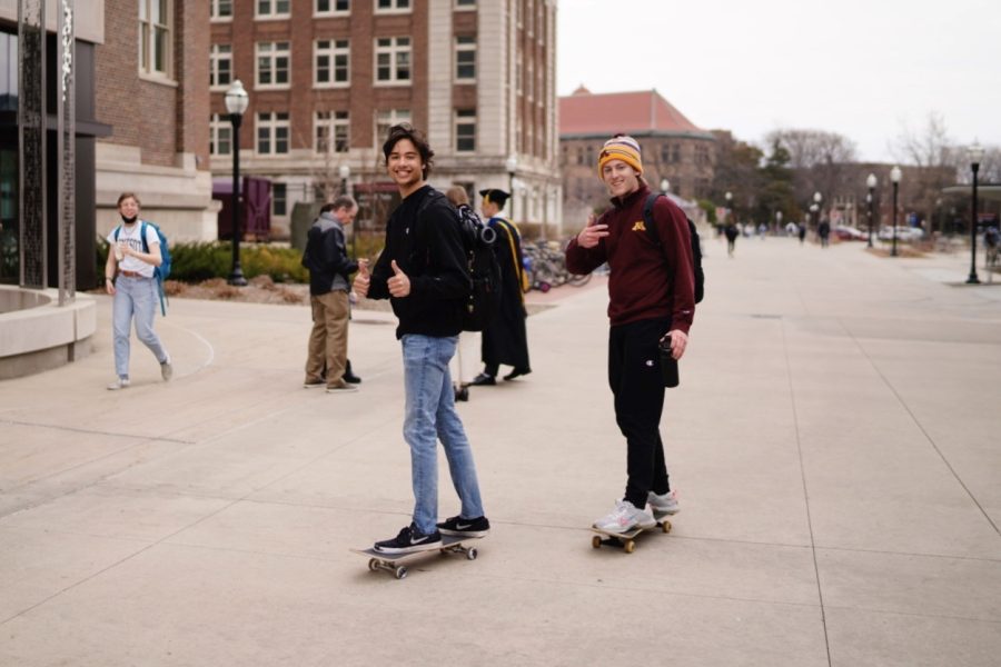 3:34 p.m. Two students skate around campus between classes. 