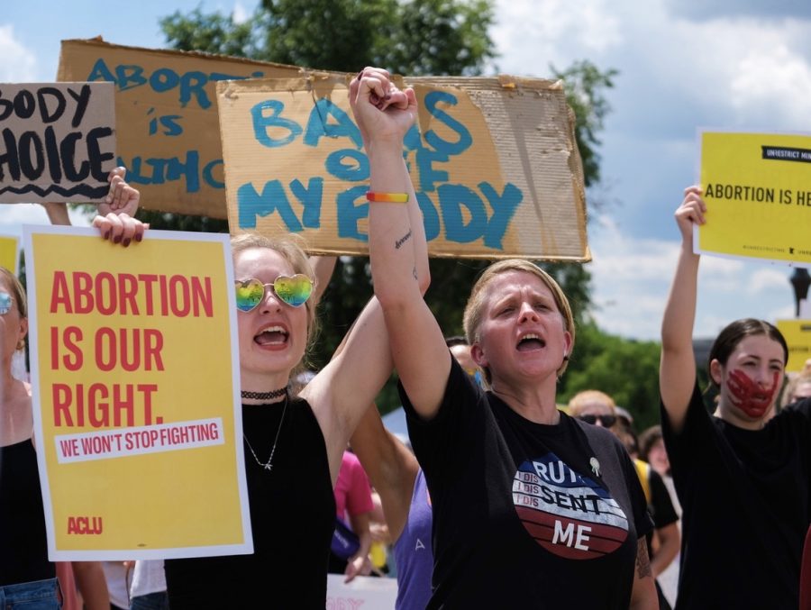Thousands of protesters gathered outside of the Capitol holding signs and wearing T-shirts advocating for reproductive rights.