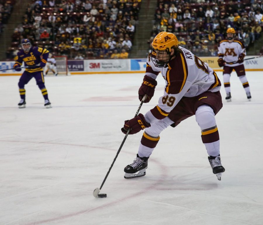 Forward Matthew Knies drives the puck toward the net during Minnesotas game against Minnesota State, Oct. 7.