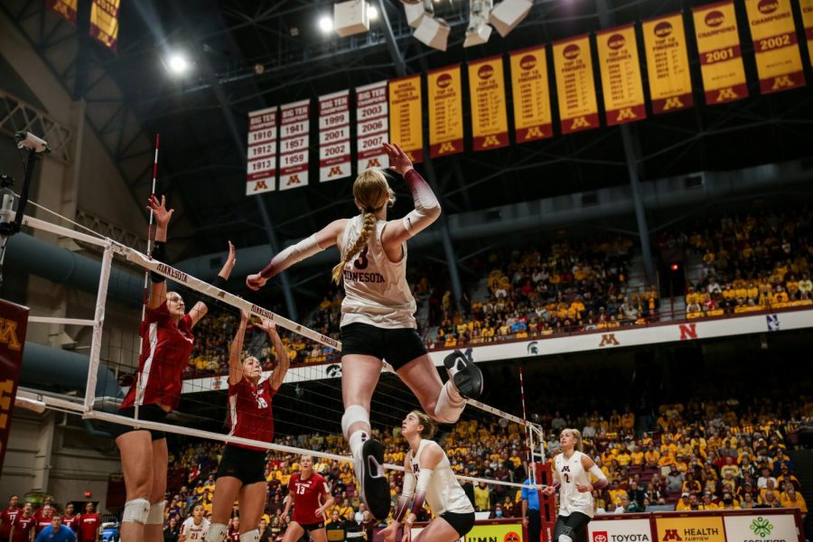 McKenna Wucherer goes up to spike the ball during the Gophers game against Wisconsin, Sept. 25.