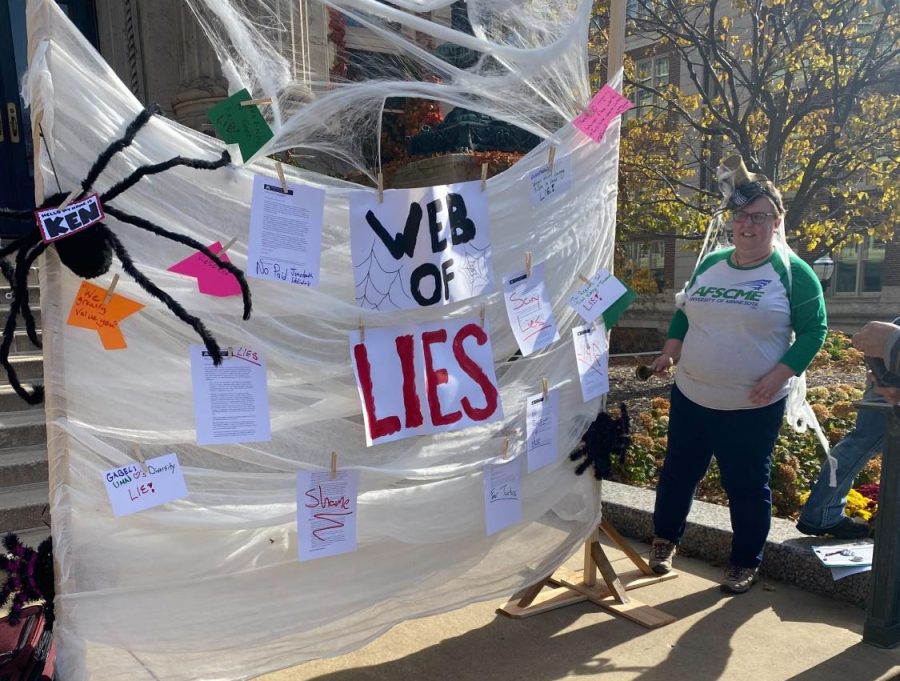 AFSCME union members held a Halloween picket in front of Morrill Hall to call out the “web of lies” they say the University has spun over the months-long bargaining process.
