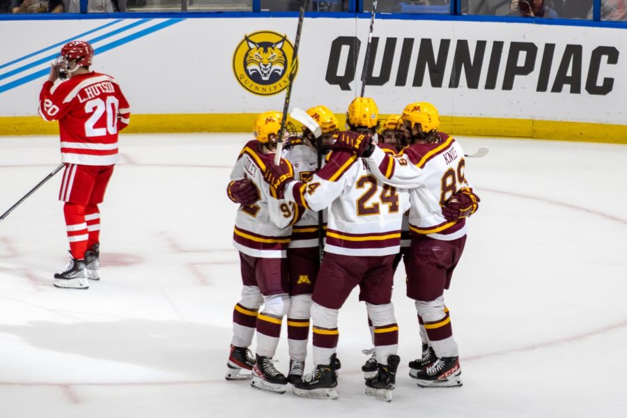The team celebrates their first goal of the tournament in the semi-final game against Boston University on Thursday, April 6, 2023.
