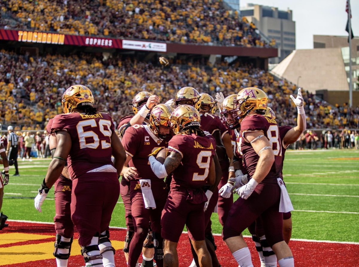 Gopher+offense+celebrating+the+Gopher+first+touchdown+of+the+homecoming+game+by+a+pass+from+Quarterback+Athan+Kaliakmanis+and+caught+by+wide+receiver+Daniel+Jackson+at+Huntingback+Stadium+on+September+30%2C+2023.